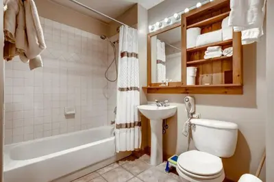 a bathroom with a toilet and a sink and a bath tub at River Run Village 2 Bedroom Condo - 100 Yards To Slopes, Pool, Hot Tub Access in Keystone