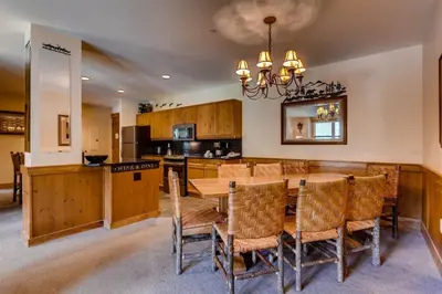a kitchen and dining room with a table and chairs at 3 Bedroom Condo In River Run With Shared Pool, Hot Tubs, 100 Yards To Gondola in Keystone