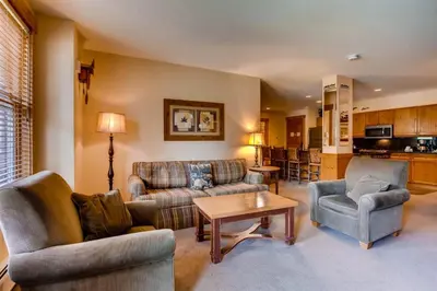a living room with a couch and two chairs and a table at 3 Bedroom Condo In River Run With Shared Pool, Hot Tubs, 100 Yards To Gondola in Keystone