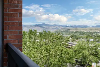 a view of the mountains from the balcony of a house at Courtyard by Marriott Denver Golden/Red Rocks in Golden