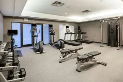 a gym with several treadmills and exercise machines at Courtyard by Marriott Denver Golden/Red Rocks in Golden