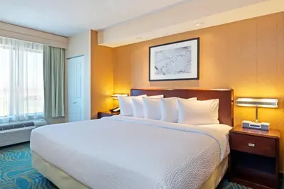 a hotel room with a large bed and a window at SpringHill Suites Boulder Longmont in Longmont