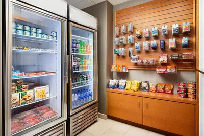 a refrigerator with its door open in a store at SpringHill Suites Boulder Longmont in Longmont