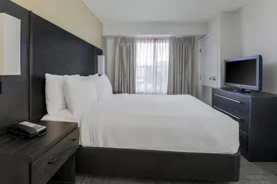 a hotel room with a bed and a television at Residence Inn by Marriott Denver Golden/Red Rocks in Golden