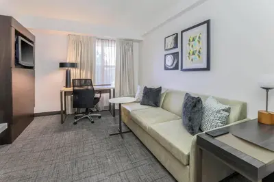 a living room with a couch and a desk at Residence Inn by Marriott Denver Golden/Red Rocks in Golden