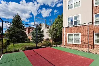 a tennis court in front of a building at Residence Inn by Marriott Denver Golden/Red Rocks in Golden