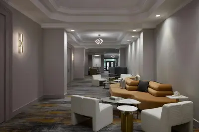 a living room with a couch and chairs at Denver Airport Marriott at Gateway Park in Aurora