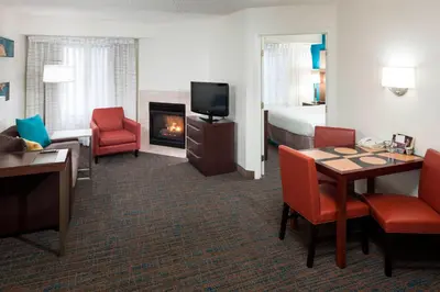 a hotel room with a living area with a fireplace at Residence Inn Denver Highlands Ranch in Highlands Ranch