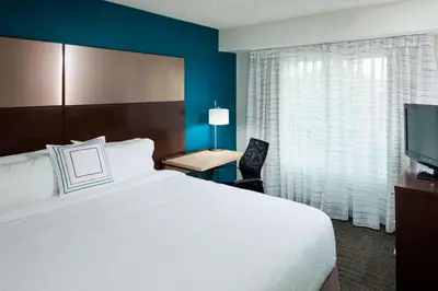 a hotel room with a bed and a television at Residence Inn Denver Highlands Ranch in Highlands Ranch