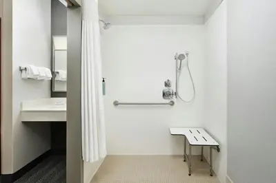 a bathroom with a shower and a sink at Courtyard Boulder Longmont in Longmont