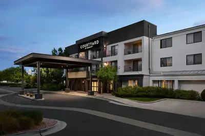a building with a parking lot in front of it at Courtyard Boulder Longmont in Longmont