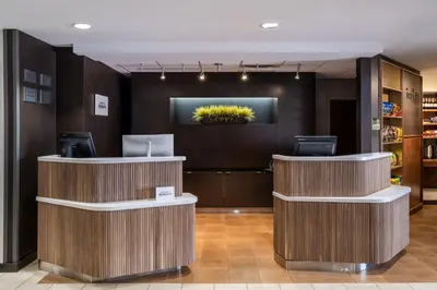 a lobby of a hotel with two reception desks at Courtyard by Marriott Denver Southwest Lakewood in Lakewood