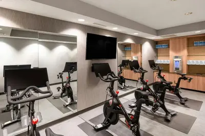 a fitness room with treadmills and elliptical machines at Courtyard by Marriott Boulder Broomfield in Louisville