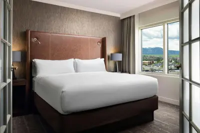 a large bed in a hotel room with a window at Renaissance Boulder Flatiron Hotel in Broomfield