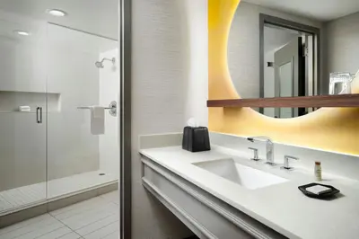 a bathroom with a sink and a shower at Renaissance Boulder Flatiron Hotel in Broomfield