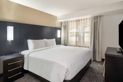 a bedroom with a large white bed and a window at Residence Inn Denver Southwest/Lakewood in Lakewood