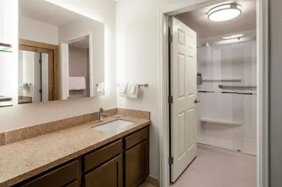 a bathroom with a sink and a mirror at Residence Inn Denver Southwest/Lakewood in Lakewood