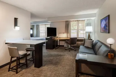 a hotel room with a couch and a living room at Residence Inn Denver Southwest/Lakewood in Lakewood