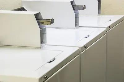 a row of white drawers in a kitchen at Residence Inn Denver Southwest/Lakewood in Lakewood