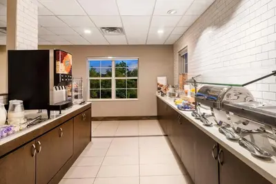 a large bathroom with sinks and a counter with a window at Residence Inn Denver Southwest/Lakewood in Lakewood