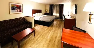 a hotel room with a bed and a couch at Quality Inn & Suites Golden - Denver West in Lakewood