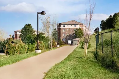 a dirt road in front of a building at TownePlace Suites by Marriott Boulder Broomfield/Interlocken in Broomfield