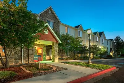 a house with a parking meter in front of a street at TownePlace Suites by Marriott Denver West Federal Center in Lakewood