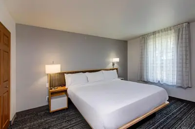 a bedroom with a large white bed and a window at TownePlace Suites Denver Southwest/Littleton in Littleton