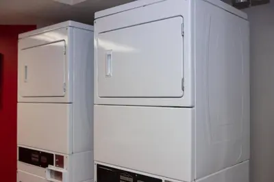 two white refrigerators sitting next to each other in a room at TownePlace Suites Denver Southwest/Littleton in Littleton
