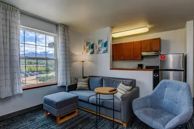 a living room with a couch and a table at TownePlace Suites Denver Southwest/Littleton in Littleton