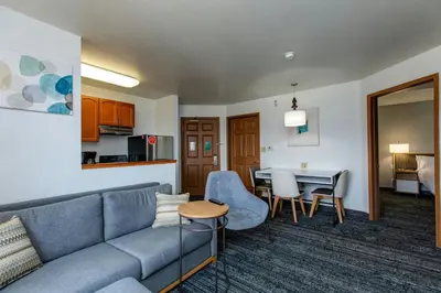 a living room with a couch and a table at TownePlace Suites Denver Southwest/Littleton in Littleton