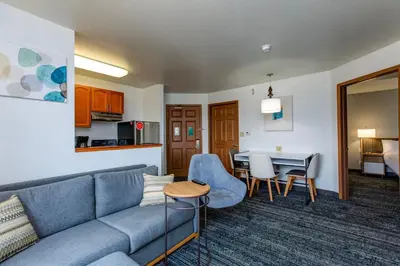 a living room with a couch and a table at TownePlace Suites Denver Southwest/Littleton in Littleton