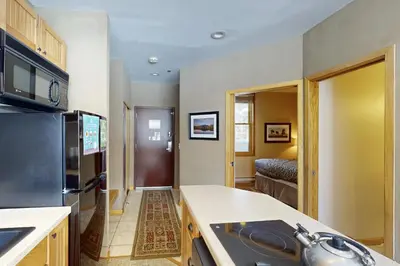 a kitchen with a sink and a counter top at River Bank Lodge 2919 in Keystone