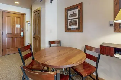 a dining room with a wooden table and chairs at Red Hawk Lodge 2200 in Dillon