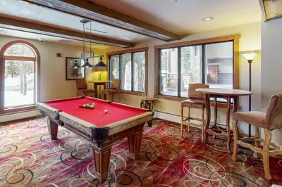 a room with a red pool table in it at Red Hawk Lodge 2200 in Dillon