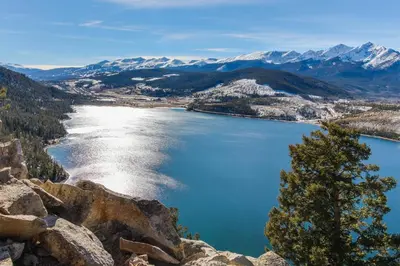 a view of a lake with snow capped mountains at Red Hawk Lodge 2286 in Dillon