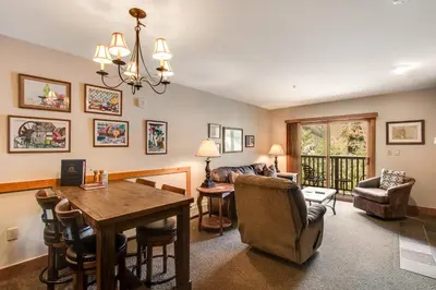 a living room with a table and a couch at Red Hawk Lodge 2286 in Dillon