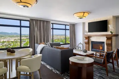a living room with a couch and a fireplace at The Westin Westminster in Westminster