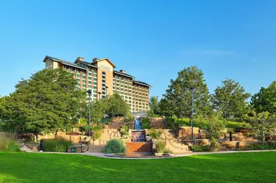 a large building with a fountain in a park at The Westin Westminster in Westminster