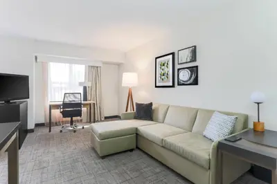 a living room with a couch and a desk at Residence Inn Boulder Longmont in Longmont