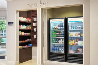 two refrigerators in a store with food inside at Residence Inn Boulder Longmont in Longmont