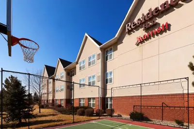 an exterior view of a hotel with a basketball hoop at Residence Inn Boulder Longmont in Longmont