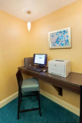 a desk with a computer and a printer on it at Residence Inn Boulder Longmont in Longmont