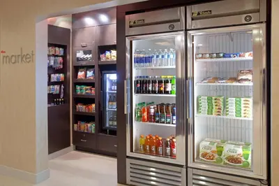 a refrigerator with its doors open in a store at Residence Inn by Marriott Boulder Broomfield in Louisville