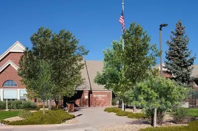 a church with an american flag in front of it at Residence Inn by Marriott Boulder Broomfield in Louisville