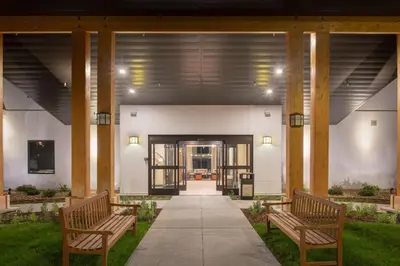 two benches sitting in front of a building at Staybridge Suites Denver South - Highlands Ranch by IHG in Littleton