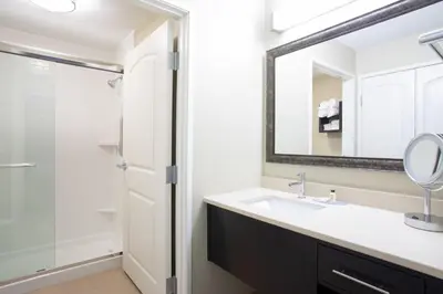 a bathroom with a sink and a shower at Staybridge Suites Denver South - Highlands Ranch by IHG in Littleton