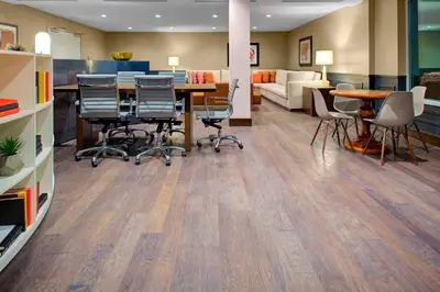 a room with a table and chairs and a couch at Residence Inn by Marriott Boulder Broomfield/Interlocken in Broomfield