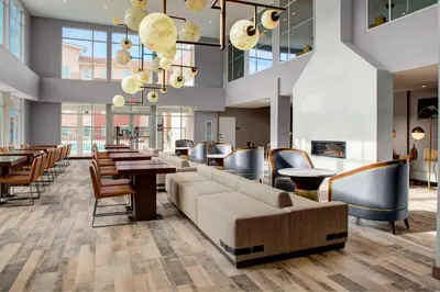 a lobby with couches and tables and chairs at Residence Inn by Marriott Boulder Broomfield/Interlocken in Broomfield