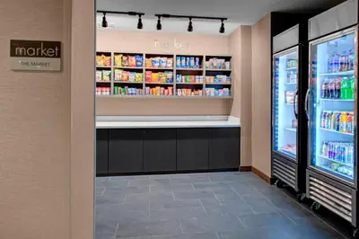 a grocery store aisle with a refrigerator and drinks at Fairfield by Marriott Inn and Suites Boulder Broomfield Interlocken in Broomfield